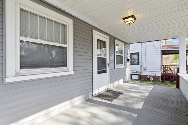 2228 8th St, Rockford, IL 61104 - wooden deck with a porch