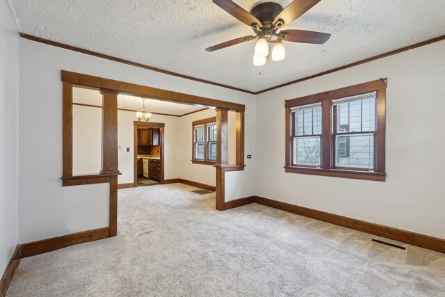 2228 8th St, Rockford, IL 61104 - unfurnished room with baseboards, light colored carpet, and ornamental molding