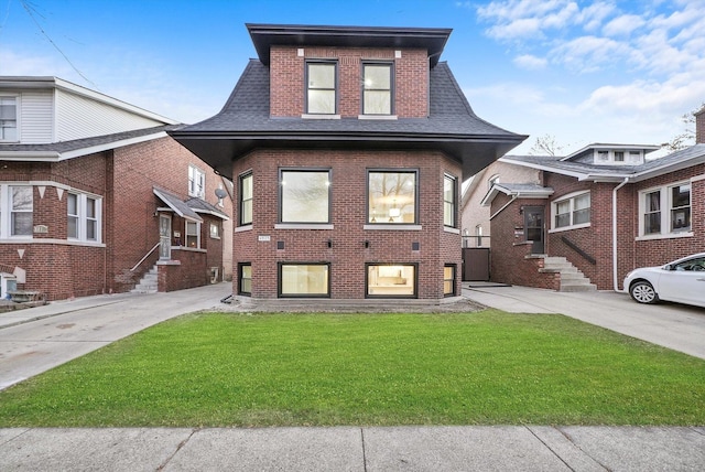 4825 W Oakdale Ave, Chicago, IL 60641 - view of front of property featuring brick siding, a front lawn, and roof with shingles