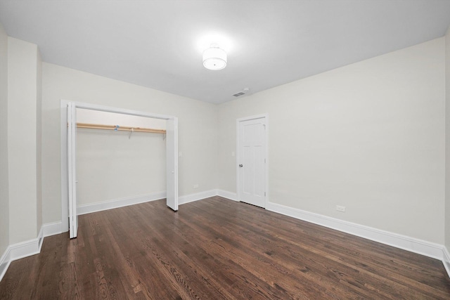 4825 W Oakdale Ave, Chicago, IL 60641 - unfurnished bedroom featuring dark wood finished floors, a closet, and baseboards