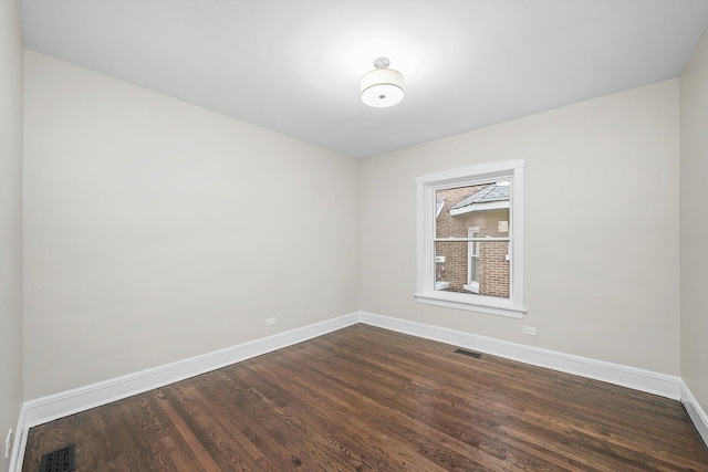 4825 W Oakdale Ave, Chicago, IL 60641 - empty room with baseboards and dark wood-style floors