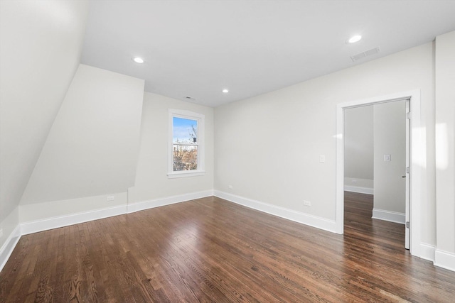 4825 W Oakdale Ave, Chicago, IL 60641 - empty room featuring dark wood finished floors, recessed lighting, and baseboards