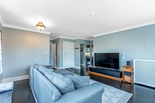 living area featuring baseboards, ornamental molding, and dark wood finished floors