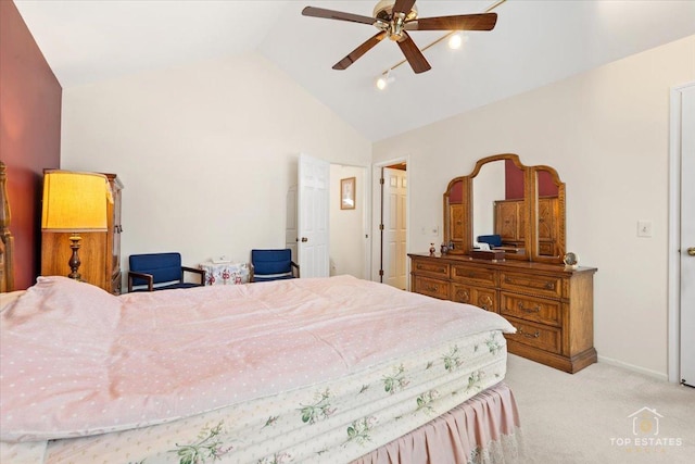 bedroom featuring carpet floors, ceiling fan, baseboards, and lofted ceiling