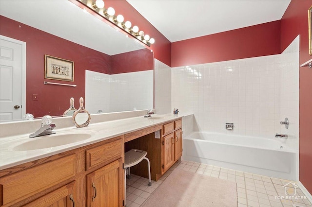 full bath featuring a sink, tile patterned flooring, double vanity, and a bath