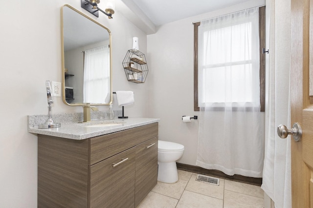 14958 Kildare Ave, Midlothian, IL 60445 - bathroom featuring toilet, tile patterned flooring, plenty of natural light, and vanity