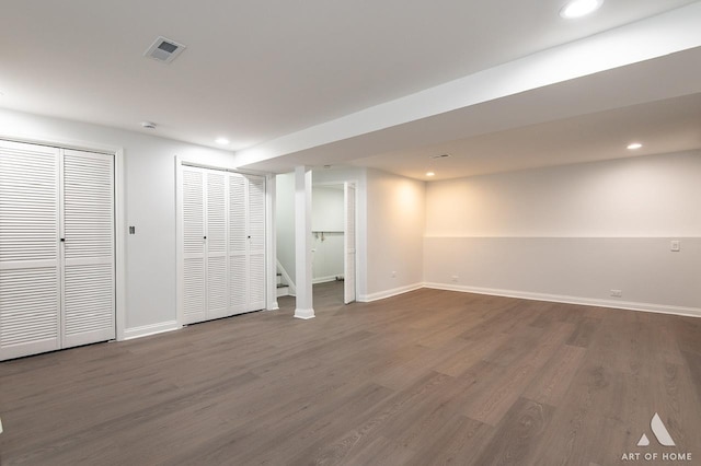 251 N Pleasant Dr, Glenwood, IL 60425 - finished below grade area featuring stairs, visible vents, a glass covered fireplace, and wood finished floors