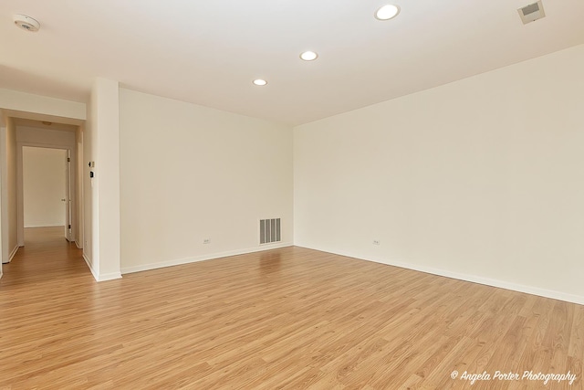 empty room with visible vents, recessed lighting, light wood-style floors, and baseboards