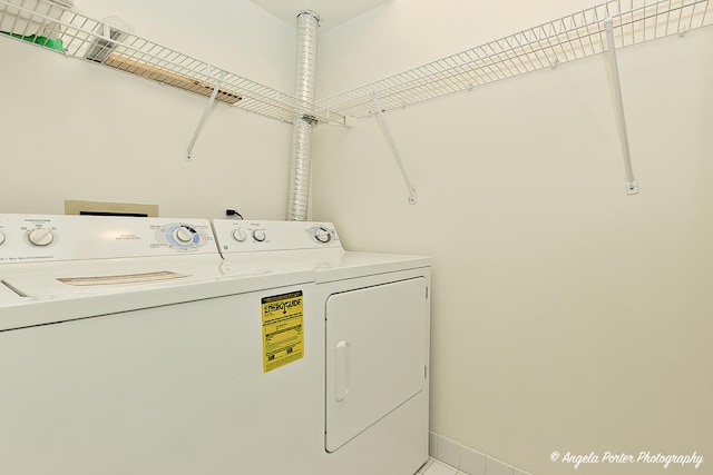 washroom with washer and dryer and laundry area