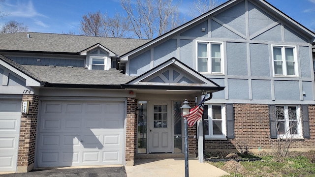 view of front of house with brick siding and stucco siding