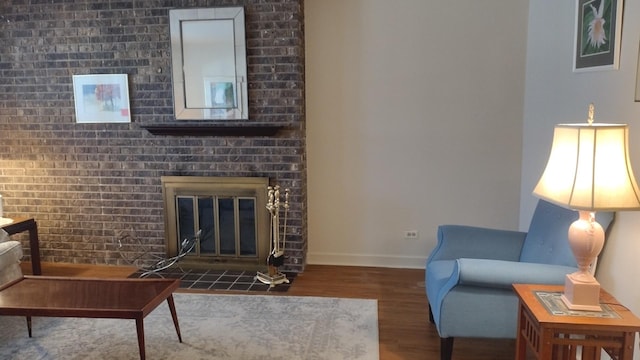 174 Grove Ave Unit B, Des Plaines, IL 60016 - living room featuring wood finished floors, baseboards, and a fireplace