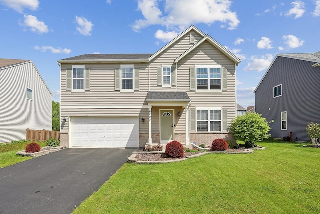 traditional-style home featuring brick siding, driveway, and an attached garage