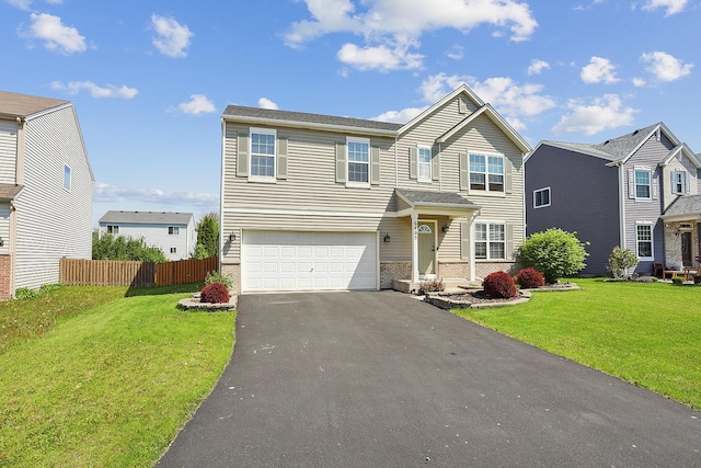 traditional-style house with a garage, asphalt driveway, and brick siding