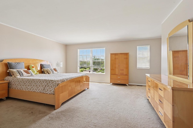 bedroom with light carpet, crown molding, baseboards, and arched walkways