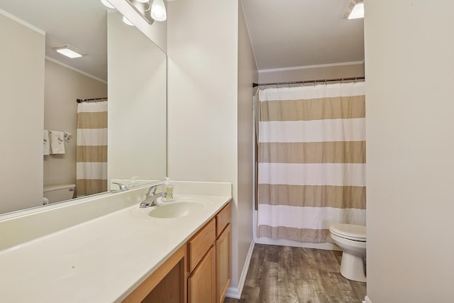 full bathroom with toilet, ornamental molding, wood finished floors, vanity, and a shower with shower curtain