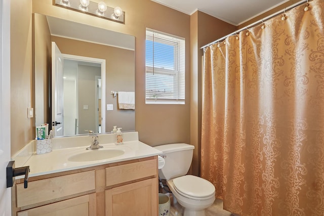 full bathroom featuring toilet, crown molding, and vanity