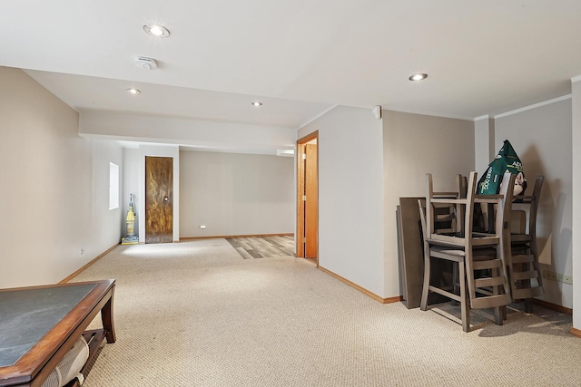 finished basement with carpet floors, baseboards, and recessed lighting