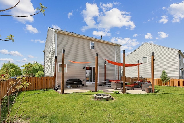 rear view of property featuring a patio area and an outdoor hangout area