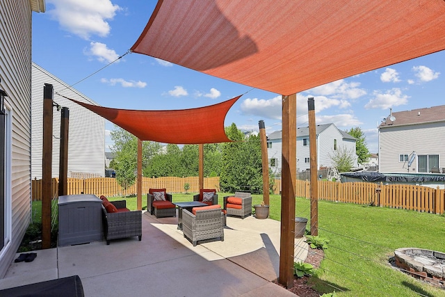 view of patio / terrace with an outdoor living space with a fire pit