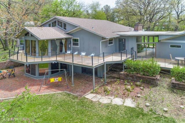 184A River Rd, Lake Barrington, IL 60010 - rear view of property featuring a patio, a chimney, a deck, and a shingled roof