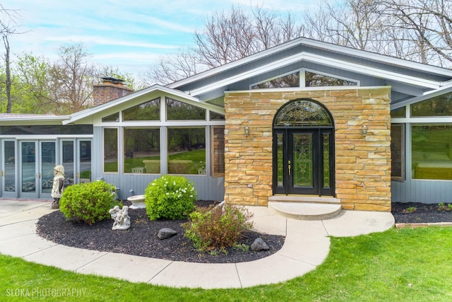 184A River Rd, Lake Barrington, IL 60010 - doorway to property featuring stone siding, french doors, and a chimney