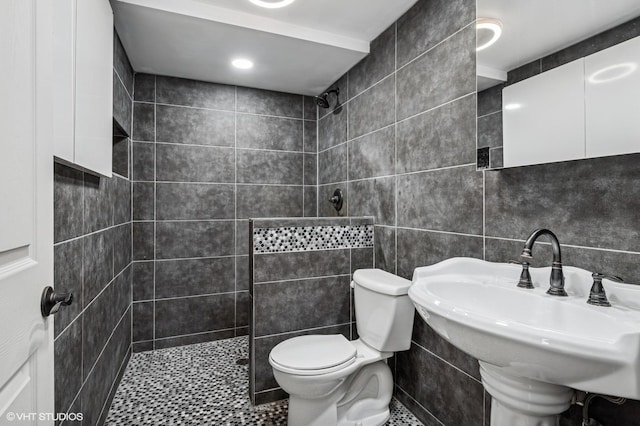 184A River Rd, Lake Barrington, IL 60010 - bathroom featuring walk in shower, toilet, a sink, tile walls, and tile patterned floors