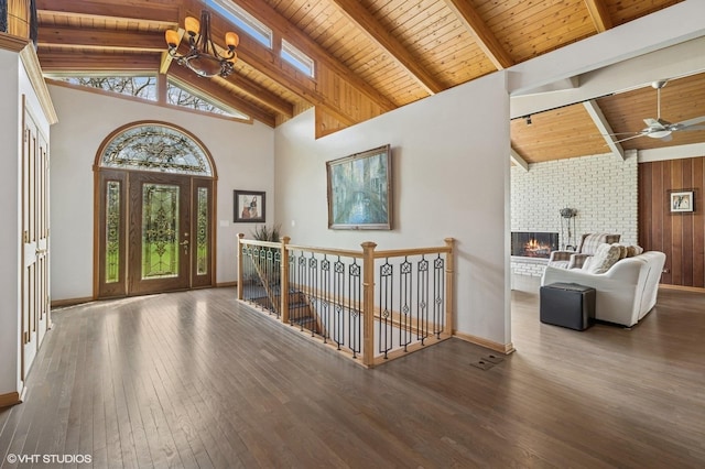 184A River Rd, Lake Barrington, IL 60010 - foyer entrance with wood ceiling, wood-type flooring, beamed ceiling, baseboards, and a fireplace