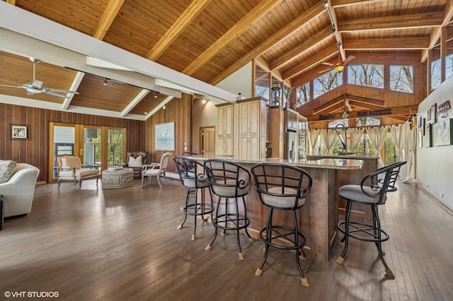 184A River Rd, Lake Barrington, IL 60010 - kitchen with a ceiling fan, high vaulted ceiling, beam ceiling, wooden walls, and dark wood-type flooring