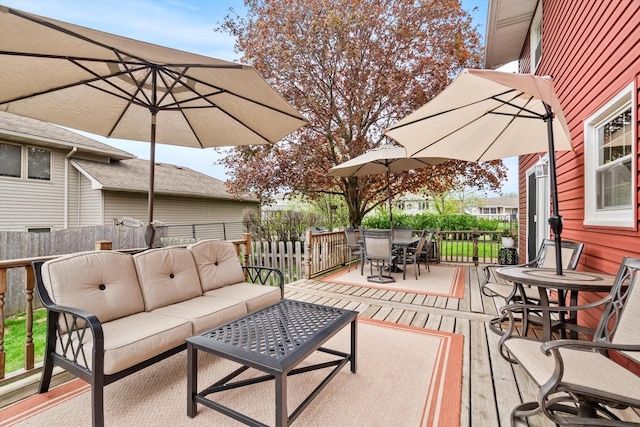 view of patio featuring fence, outdoor dining area, and outdoor lounge area