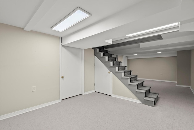 finished below grade area with baseboards and stairs