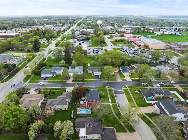 birds eye view of property with a residential view