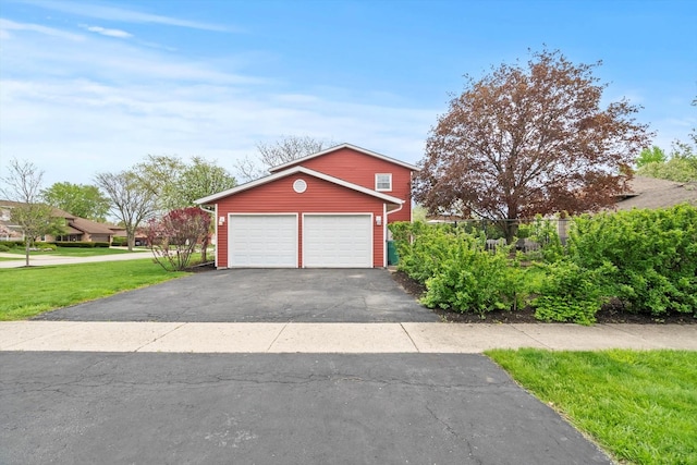 garage with aphalt driveway