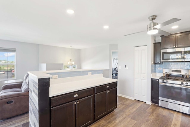 1046 Piccolo Ln, Volo, IL 60073 - kitchen featuring stainless steel appliances, decorative backsplash, dark brown cabinetry, light countertops, and recessed lighting