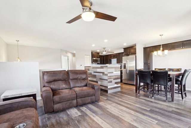 1046 Piccolo Ln, Volo, IL 60073 - living area with ceiling fan, wood finished floors, recessed lighting, a chandelier, and baseboards