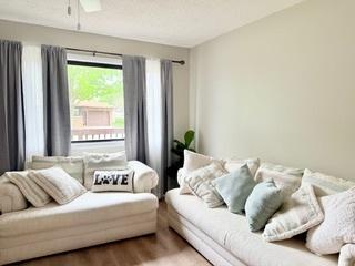 interior space featuring ceiling fan and wood finished floors