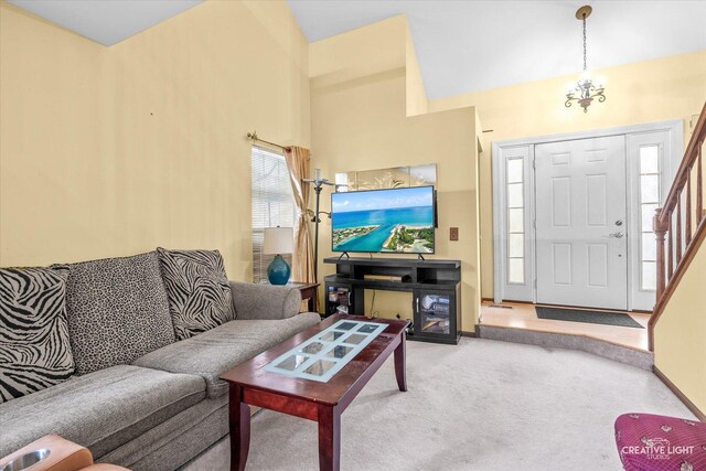 1081 Hunt Wyck Ct Unit 1081, Elgin, IL 60120 - living area with baseboards, a high ceiling, stairs, and light colored carpet