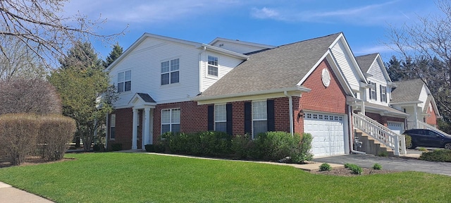 view of front of home with driveway, roof with shingles, a garage, brick siding, and a front lawn