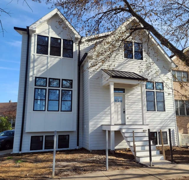 5365 N Bowmanville Ave, Chicago, IL 60625 - view of front facade featuring a standing seam roof and a metal roof