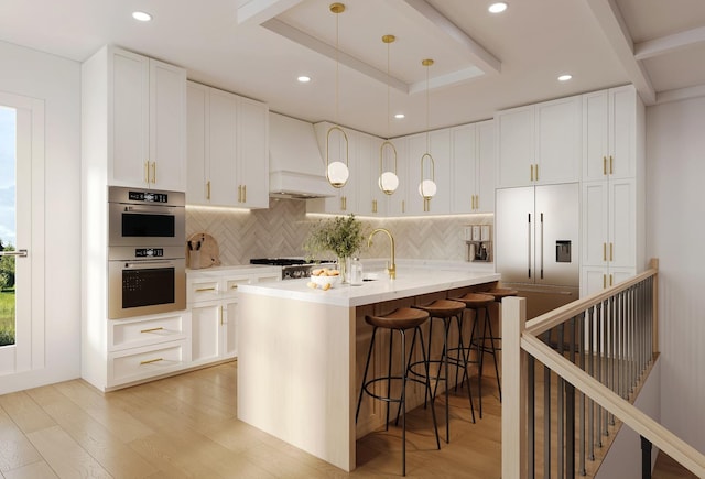 5365 N Bowmanville Ave, Chicago, IL 60625 - kitchen with tasteful backsplash, a kitchen breakfast bar, white cabinetry, and recessed lighting