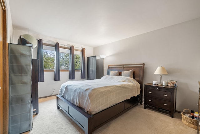bedroom with light colored carpet