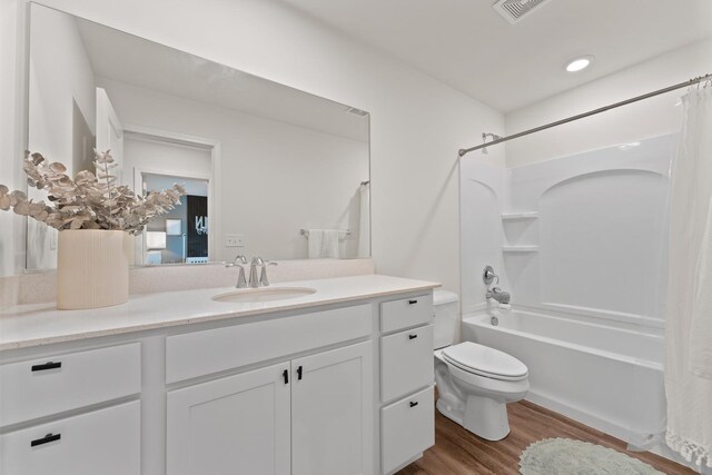 172 Barry Rd, South Elgin, IL 60177 - bathroom featuring shower / bath combo, vanity, toilet, wood finished floors, and visible vents