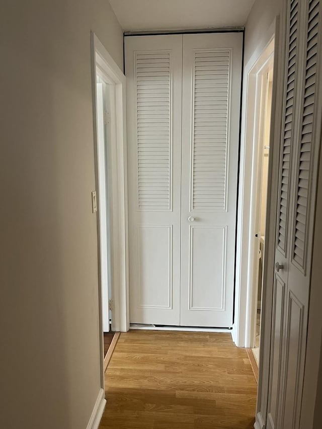 hall with light wood-style floors