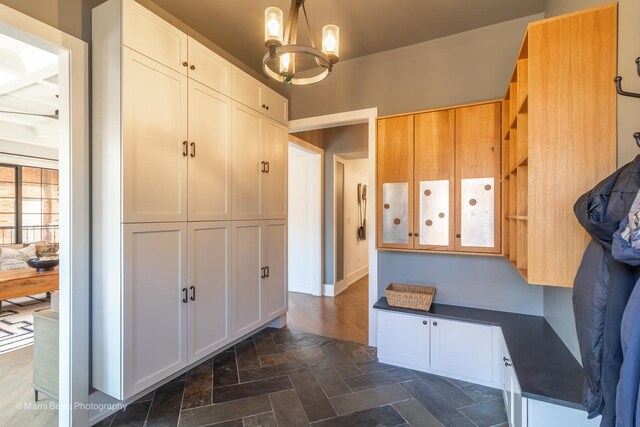 6907 S Constance Ave, Chicago, IL 60649 - mudroom with a notable chandelier and stone finish floor