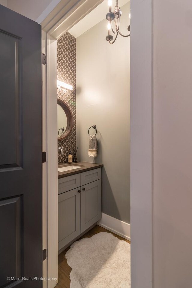 6907 S Constance Ave, Chicago, IL 60649 - bathroom featuring an inviting chandelier and vanity