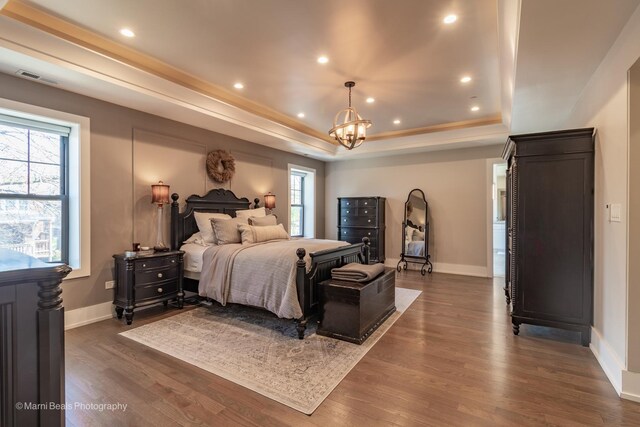 6907 S Constance Ave, Chicago, IL 60649 - bedroom featuring recessed lighting, a tray ceiling, dark wood-style floors, and visible vents
