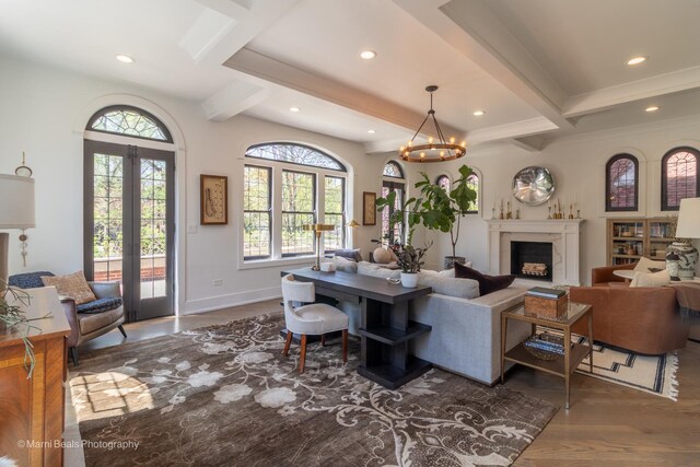 6907 S Constance Ave, Chicago, IL 60649 - living room with plenty of natural light, wood finished floors, french doors, and beamed ceiling