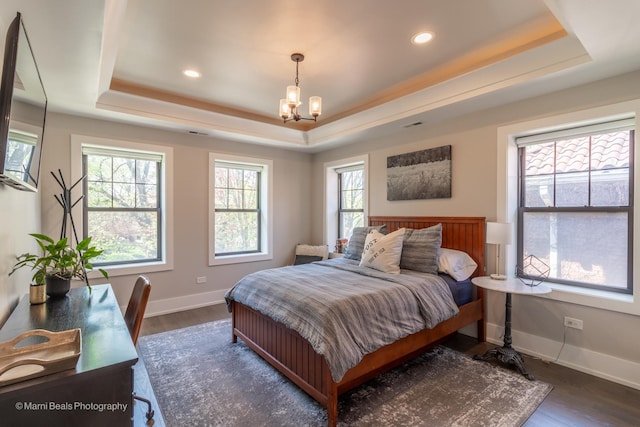 6907 S Constance Ave, Chicago, IL 60649 - bedroom with recessed lighting, a raised ceiling, dark wood finished floors, and a notable chandelier