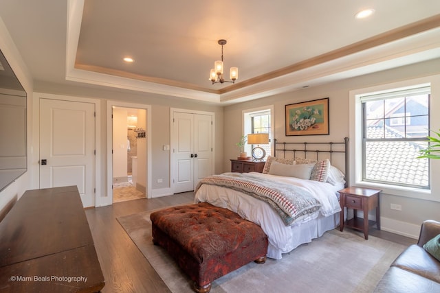 6907 S Constance Ave, Chicago, IL 60649 - bedroom featuring a raised ceiling, baseboards, a chandelier, light wood-style floors, and recessed lighting