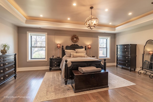 6907 S Constance Ave, Chicago, IL 60649 - bedroom featuring an inviting chandelier, a raised ceiling, and multiple windows