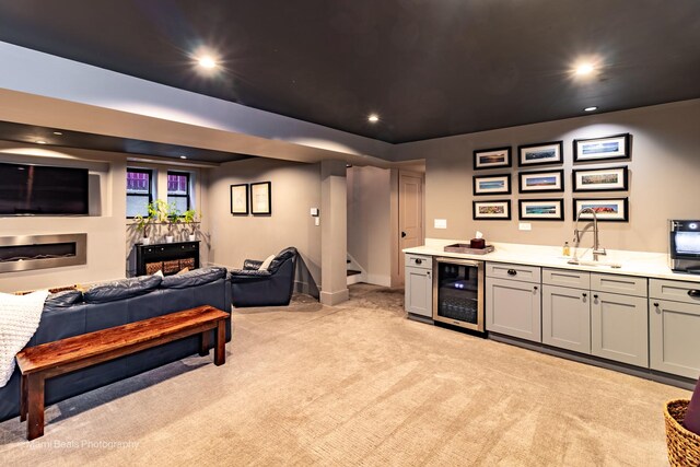 6907 S Constance Ave, Chicago, IL 60649 - bar with light carpet, beverage cooler, recessed lighting, bar, and a sink